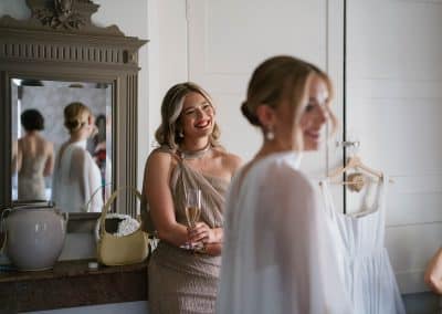 The bride and bridesmaids enjoying getting ready for the ceremony