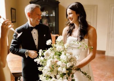 A bride and her father share a nervous moment ahead of the wedding ceremony