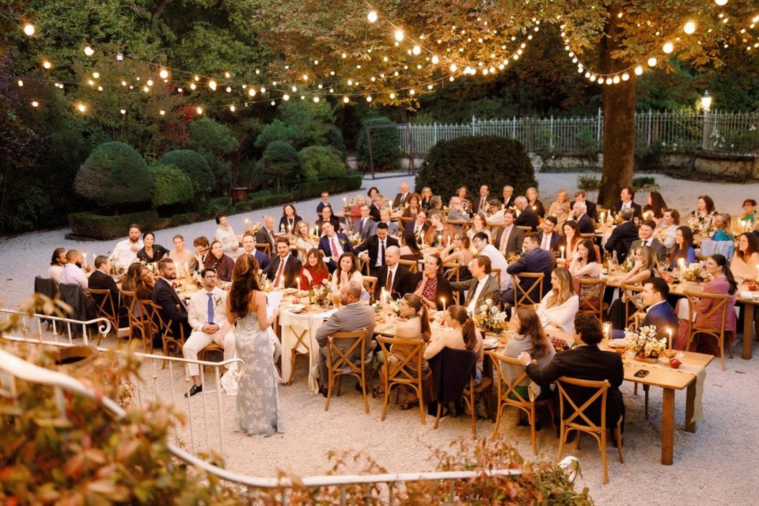 The bride's mother making a speech to the guests in the courtyard of Chateau de Lartigolle