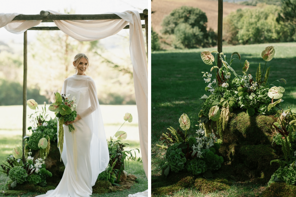 A bride poses for photographs surrounded but the stunning floral designs for her ceremony in the pasture at Chateau de Lartigolle.